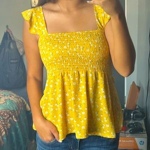 Yellow floral top; Size Medium and material is thin and flowy
